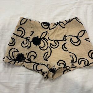 Detailed shorts, size M. Used. Zipper on back.